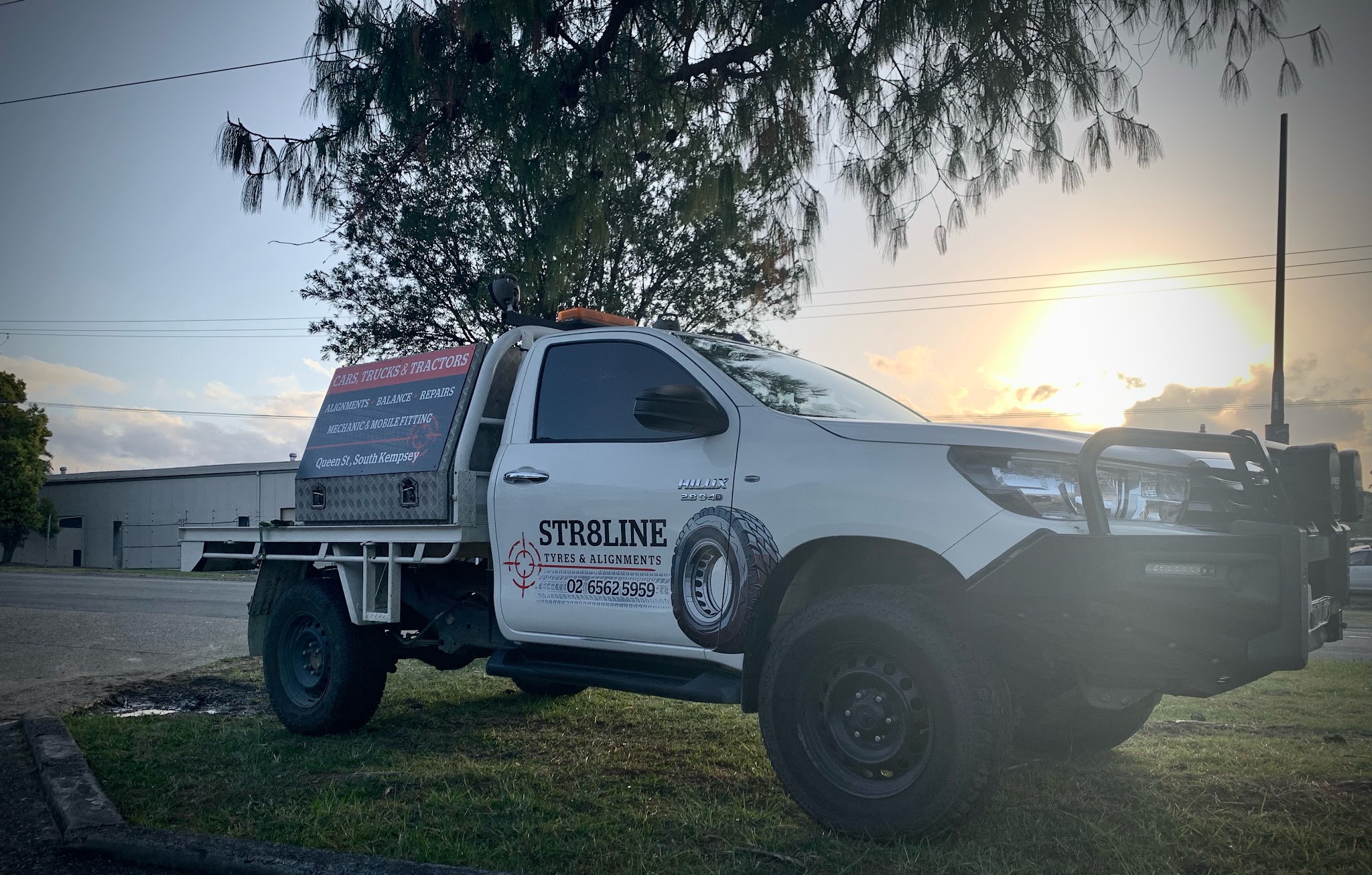 The Str8line service ute parked outside the workshop at sunset